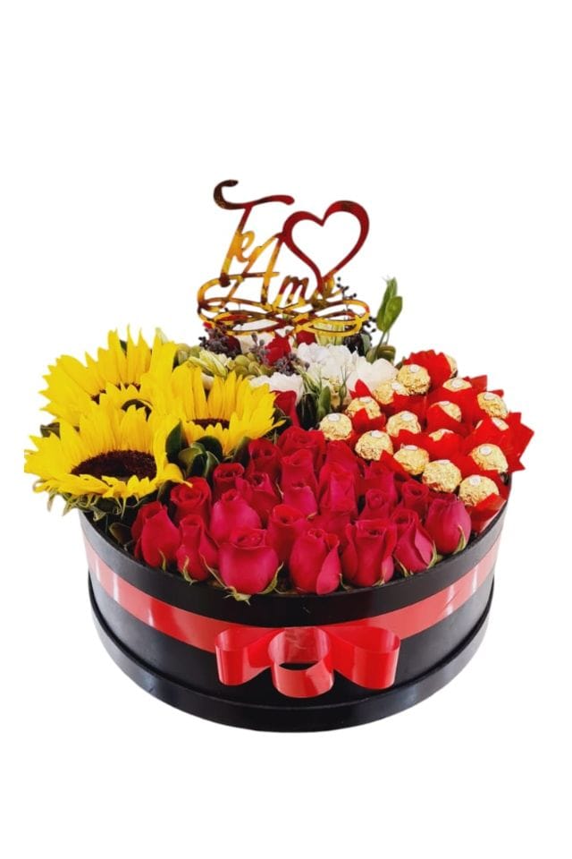 CAJA DE MADERA REDONDA CON ROSAS ROJAS DE INVERNADERO,GIRASOLES ,CHOCOLATES FERRERO ROCHER CON PIN DE “TE AMO”